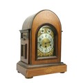 An Edwardian marquetry inlaid chiming dome top Bracket Clock, the brass and silverised dial with Ara... 