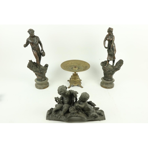 57 - A pair of Spelter Figures, 'L'Agriculture' 18'' (46cms), together with a brass Table Centre, on four... 