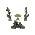 A pair of Spelter Figures, 'L'Agriculture' 18'' (46cms), together with a brass Table Centre, on four... 