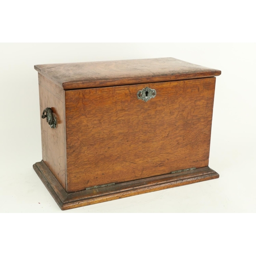 70 - An Edwardian oak Table Desk, the lift top and pull down front revealing a fitted interior with fold ... 