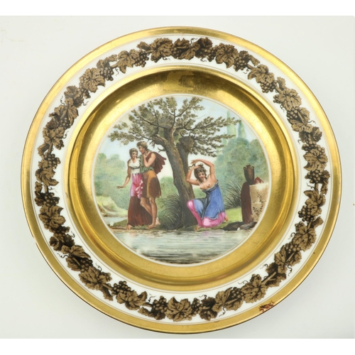 74 - An attractive hand painted Continental Dish, 'L'Origine de la Coquettere,' 23 cms diameter. (1)... 