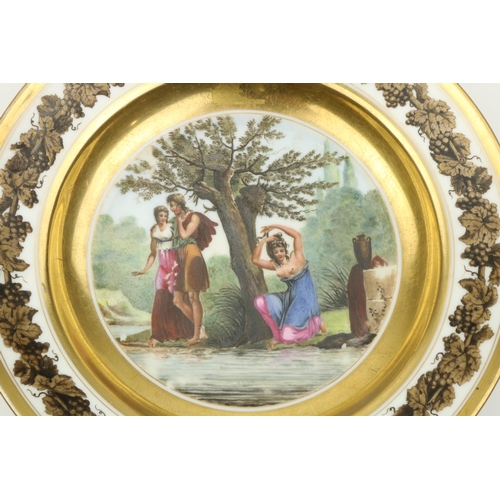 74 - An attractive hand painted Continental Dish, 'L'Origine de la Coquettere,' 23 cms diameter. (1)... 