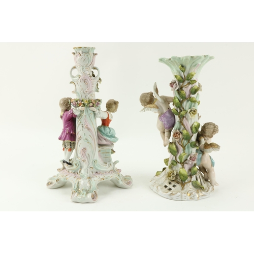 96 - A Sitzendorf porcelain Table Lamp, with flowers and two cupids surmounted; and a Sitzendorf Centerpi... 