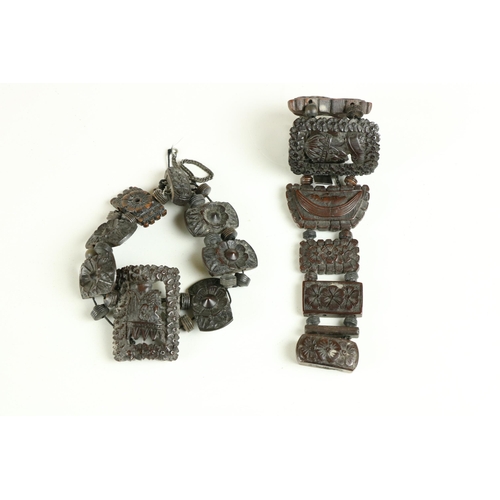 99 - Two early carved fruitwood Bracelets, possibly Bavarian, each with central side profiles of  bearded... 