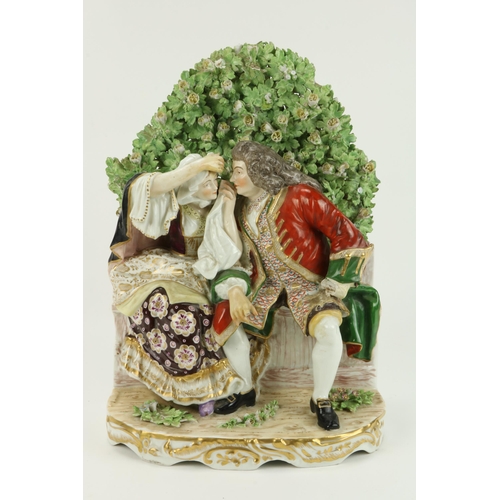 118 - A large and attractive 19th Century porcelain Group, Gentleman & Lady seated on a bench with hea... 