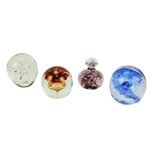 138 - Four assorted heavy glass Paper Weights. (4)