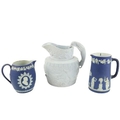 A good quality Jasperware Wedgwood blue and white Jug, of bulbous form decorated with medallion port... 