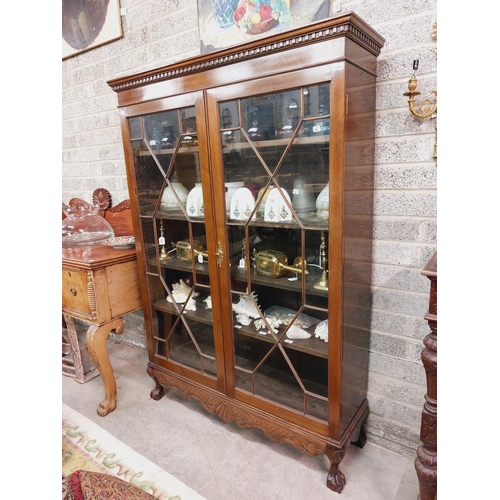 31 - A Chippendale style mahogany Display Cabinet, with dentil moulded cornice above two astragal glazed ... 
