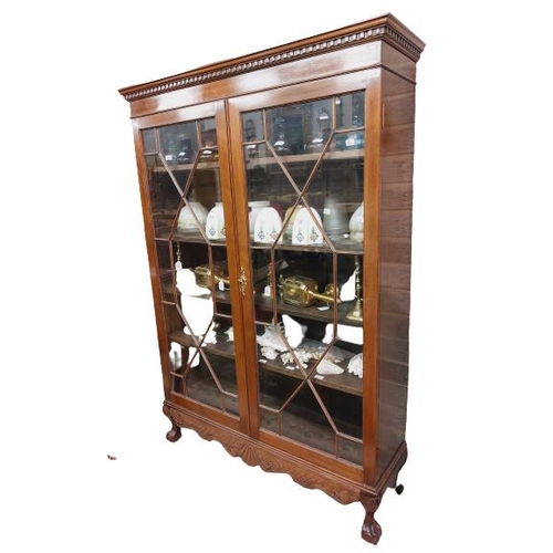 31 - A Chippendale style mahogany Display Cabinet, with dentil moulded cornice above two astragal glazed ... 