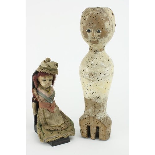 188 - A Queen Anne period carved and painted wooden Dolls Body, the head with coloured glass eyes, (lacks ... 