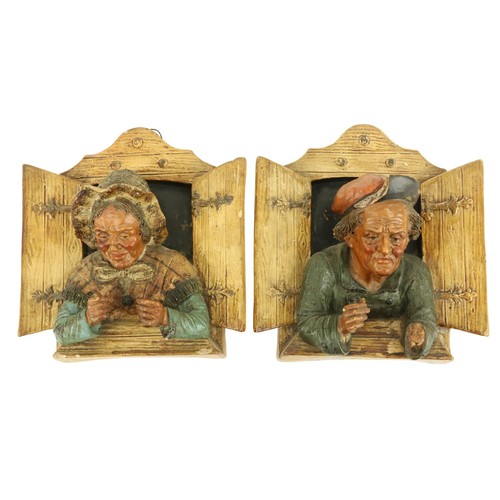 407 - A good pair of late 19th Century German terracotta Wall Figures, modelled in high relief depicting a... 