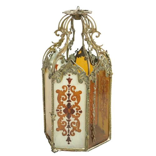 447 - A good Neo-Gothic style brass hexagonal shaped Hall Lantern, with six coloured glass panels, each in... 