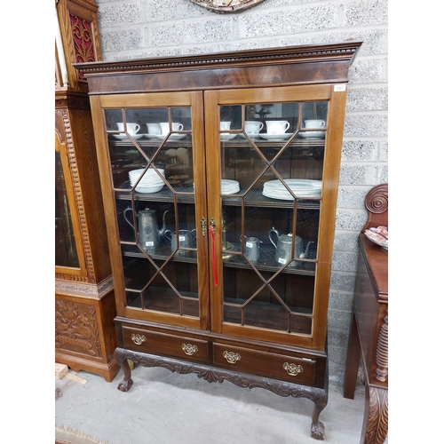 15 - A Chippendale style mahogany Display Cabinet, on associated stand with dentil moulded cornice above ... 