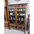 A Chippendale style mahogany Display Cabinet, on associated stand with dentil moulded cornice above ... 