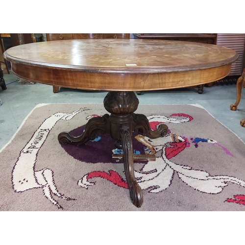 402 - A Victorian style circular pod Dining Table, with floral marquetry top, over plain frieze on carved ... 