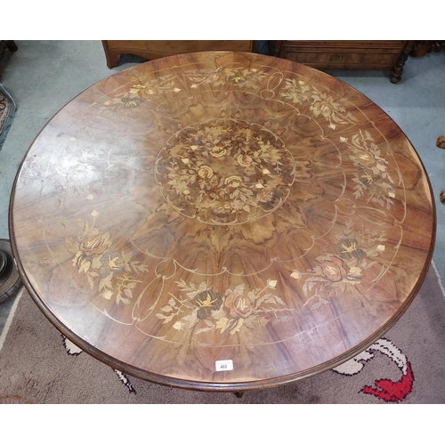 402 - A Victorian style circular pod Dining Table, with floral marquetry top, over plain frieze on carved ... 