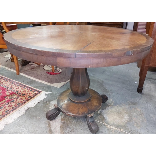 405 - A 19th Century rosewood and mahogany segmented circular Hall Table, the shaped support on circular p... 