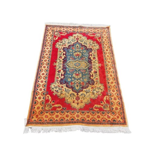 443 - An Oriental style cotton Runner, with a row of medallions on a burgundy ground, 344cms x 81cms (135