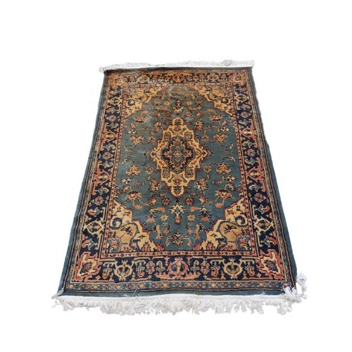 443 - An Oriental style cotton Runner, with a row of medallions on a burgundy ground, 344cms x 81cms (135