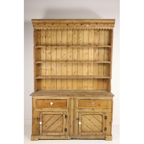 150 - A 19th Century Irish pine Dresser, with four shelf back on a plank top base with two drawers and two... 