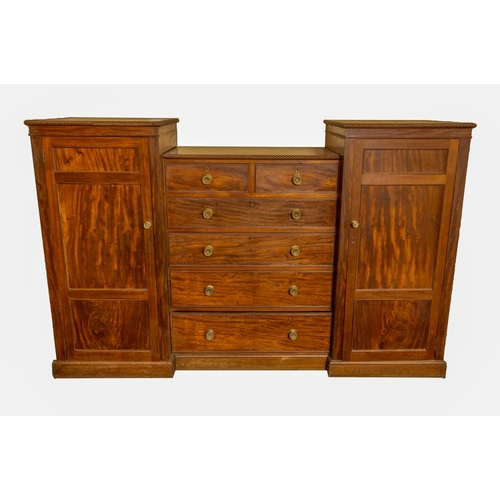 179 - A George IV period Irish mahogany Wardrobe Chest, the three panel pedestal doors with shelves and ha... 