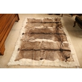 A large goat skin Rug, with three pelts, 198cms x 155cms (78
