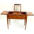 An antique French Poudreuse (Ladies Dressing Table), in kingwood and rosewood with three hinged... 