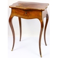 A French marquetry and brass mounted Ladies Vanity Table, of serpentine form, the top with marquetry... 