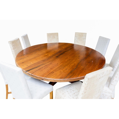 538 - A monumental circular red teak Dining Table, on a large heavy quadruple pod, approx. 213cms (84