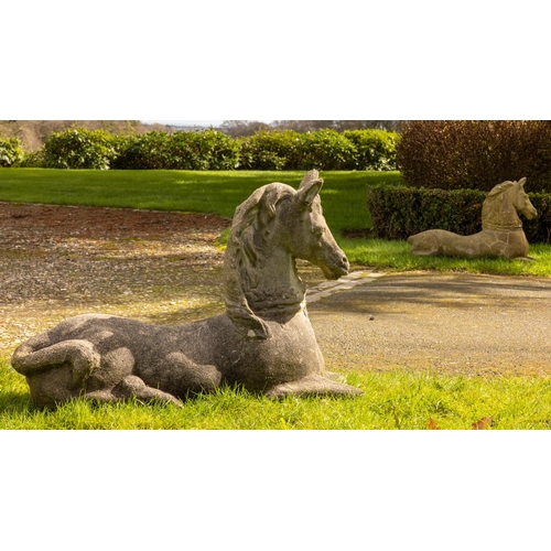 553 - A pair of attractive 19th Century sandstone Figures, of opposing reclining horses, each approx. 92cm... 