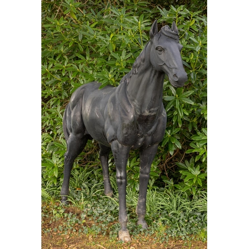 555 - An extremely fine and heavy cast bronze Figure of a standing Gelding, standing four facing forward, ... 