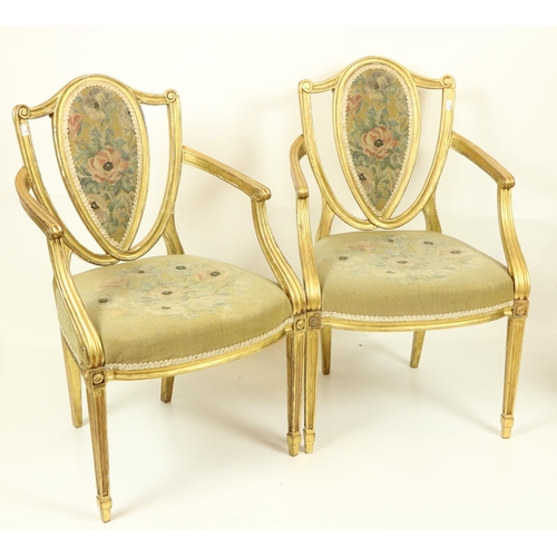 75 - A fine set of four Regency gilt Open Armchairs, in the manner of James Wyatt (1746-1813), each with ... 