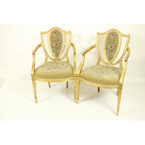 75 - A fine set of four Regency gilt Open Armchairs, in the manner of James Wyatt (1746-1813), each with ... 