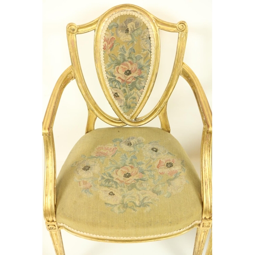 75 - A fine set of four Regency gilt Open Armchairs, in the manner of James Wyatt (1746-1813), each with ... 