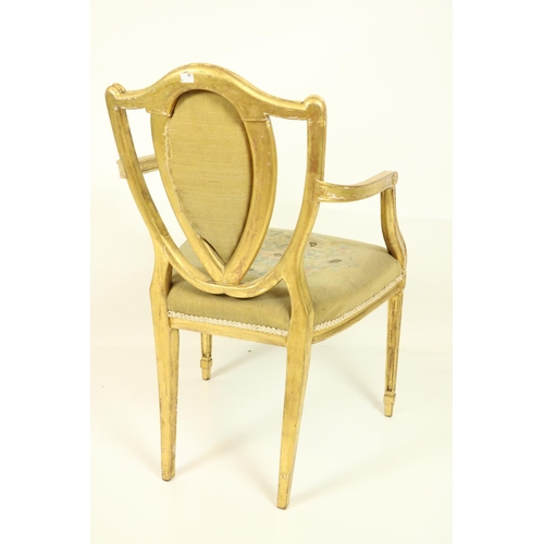 75 - A fine set of four Regency gilt Open Armchairs, in the manner of James Wyatt (1746-1813), each with ... 