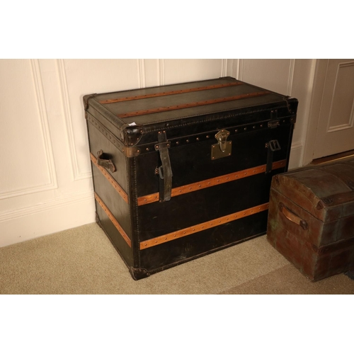 85 - A very large leather and wooden bound Steamer Trunk, with brass studs and two leather carrying handl... 