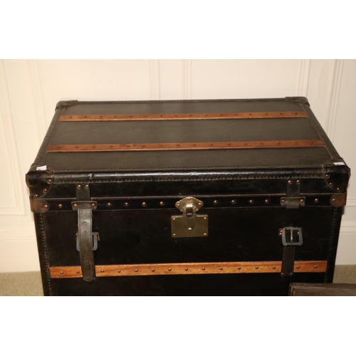 85 - A very large leather and wooden bound Steamer Trunk, with brass studs and two leather carrying handl... 