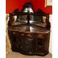An Edwardian Chippendale style Corner Drinks or Cocktail Stand, the three quarter gallery with an ar... 