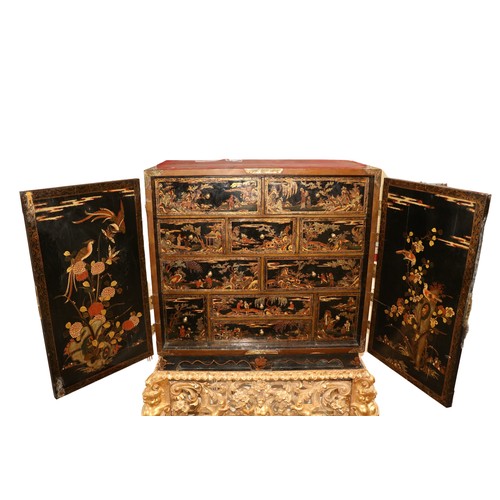 94 - An exceptional fine 18th Century chinoiserie lacquered two door Cabinet on Stand, the interior with ... 