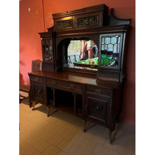 156 - An Edwardian carved mahogany Sideboard Chiffonier, the moulded cornice above two cupboard doors each... 