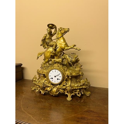 180 - A 19th Century brass and ormolu French Mantle Clock, stamped on verso P.H. Mourey, surmounted with m... 