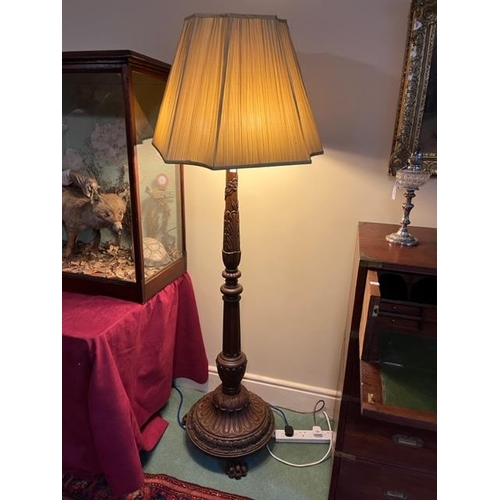 194 - A very attractive Chippendale style mahogany Standard Lamp, with three stage stem carved with leaves... 