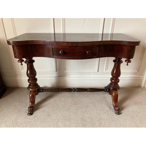 66 - A Victorian serpentine fronted Dressing Table, with frieze drawer on turned supports united with tur... 