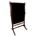 A good Regency period mahogany swing frame Cheval Dressing Mirror, with two urn finials on half balu... 