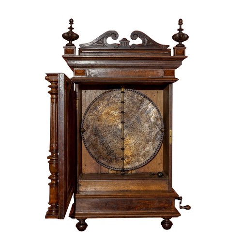 166 - A late Victorian walnut cased Polyphon, playing 19