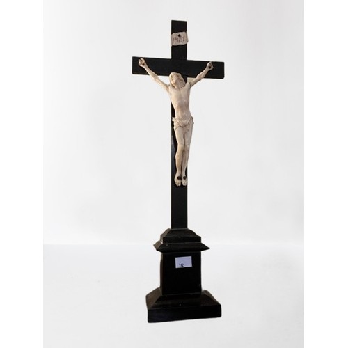 192 - A late 19th Century carved 'Corpus Christi,' French probably Dieppe, mounted on an ebonised cross wi... 