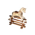 A 19th Century painted Hobby Horse, with leather saddle on pine stand, 97cms x 102cms (38