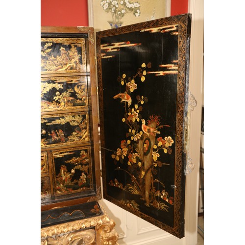 94 - An exceptional fine 18th Century chinoiserie lacquered two door Cabinet on Stand, the interior with ... 