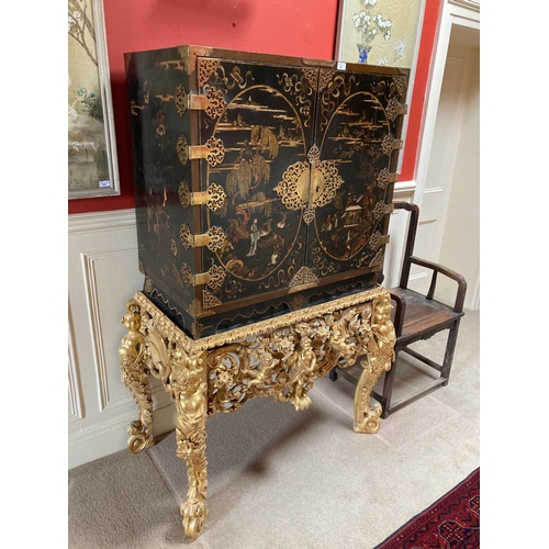 94 - An exceptional fine 18th Century chinoiserie lacquered two door Cabinet on Stand, the interior with ... 