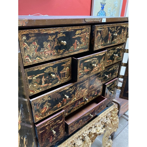 94 - An exceptional fine 18th Century chinoiserie lacquered two door Cabinet on Stand, the interior with ... 